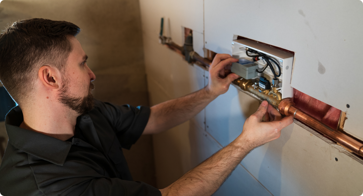 installer installing the water device